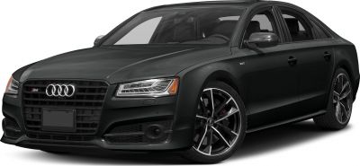 Front side view of a sedan with aggressive grille and alloy wheels