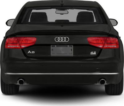 Rear view with LED taillights, dual exhausts, and emblem badges