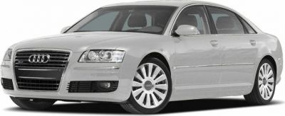 Front three-quarter view of luxury sedan with distinct grille and headlights