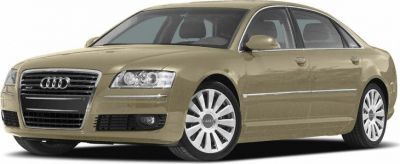 Front-side view of luxury sedan with distinctive grille and alloy wheels