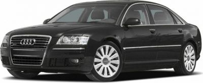 Front side view of a luxury sedan with distinctive grille and alloy wheels