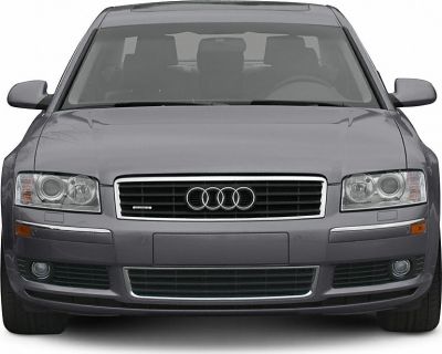 Front view featuring grille, headlights, and fog lights