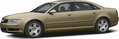 Side profile of a four-door luxury sedan with alloy wheels and metal trim.