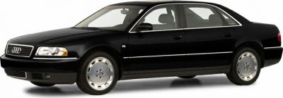 Luxury sedan side profile with distinctive alloy wheels and chrome window trim