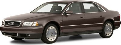 Front side view of a four-door luxury sedan with alloy wheels.