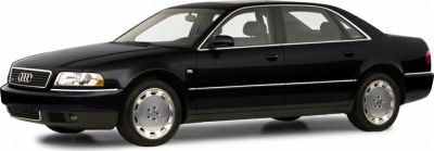 Front side profile of a black 1999 facelift sedan with alloy wheels