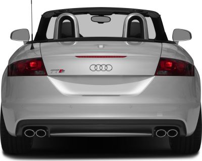 Rear view of convertible with dual exhausts and roll bars