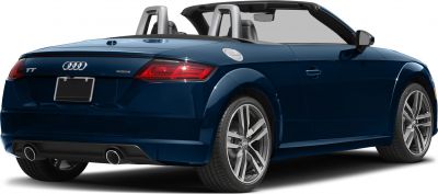 Rear view of open-top roadster with dual exhaust and alloy wheels