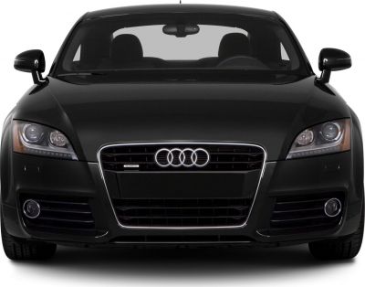 Front view of a car with grille, headlights, and fog lights