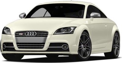 White coupe front view with prominent grille and alloy wheels.