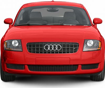 Front view with distinctive headlights and grille of a red coupe.