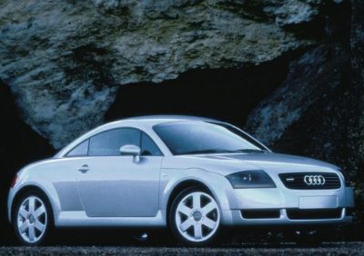 Silver coupe with curved roof and sporty two-door design