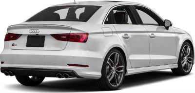 Rear side view of a sedan with quad exhaust and alloy wheels