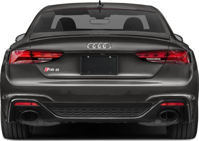 Rear view with distinctive taillights and dual exhausts