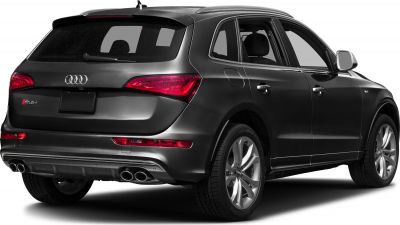 Rear perspective of SUV highlighting quad exhaust and LED taillights