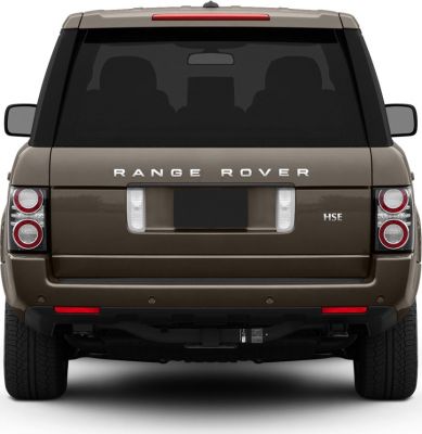 Rear view showing dual circular tail lights and rear window of SUV