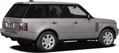 Silver luxury SUV rear side view with tinted windows and alloy wheels