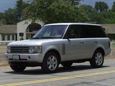 Silver SUV front side with grille and headlights