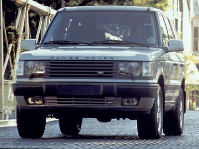 Front view showing grille, headlights, and bumper of classic luxury SUV