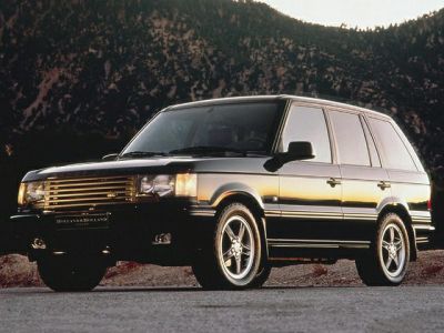 Boxy mid-90s SUV with bold grille and alloy wheels