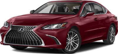 Close-up of front spindle grille and headlight of a maroon luxury sedan