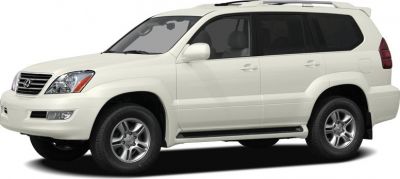White SUV front side view with alloy wheels and roof rails
