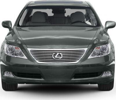 Front view of car featuring horizontal chrome grille and multi-lens headlights