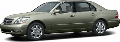 Front side view of luxury sedan with chrome grille and multi-spoke wheels