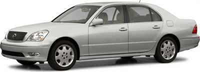 Side profile of a silver luxury sedan with smooth body lines and distinct wheel design