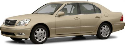 Beige luxury sedan front side view with alloy wheels