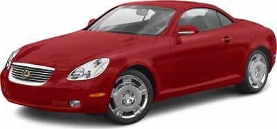 Red coupe with front grille and polished wheels