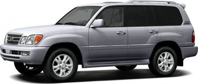 Side profile of silver SUV with alloy wheels and roof rails