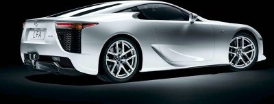 Rear side view with quad exhaust tips and alloy wheels