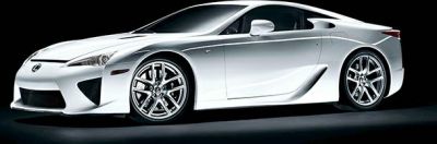 Aerodynamic side profile of a silver mid-engine sports coupe with distinctive alloy wheels.