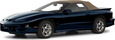 Side profile of a convertible sports car with soft top and alloy wheels