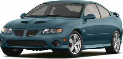 Sport coupe with dual front hood scoops and rear spoiler