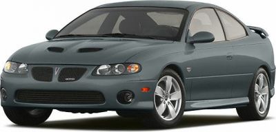 Sporty front end with dual hood scoops and alloy wheels
