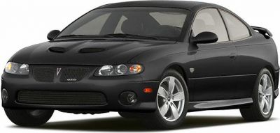 Black coupe with dual hood scoops and rear spoiler.