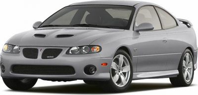 Front-side view showing dual hood vents, sporty wheels, and coupe body style.