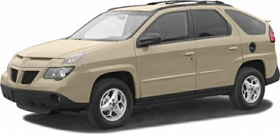 Side profile of compact SUV with unique front grille and beige paint.
