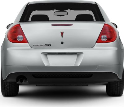Rear view of a sedan with distinctive taillights and badge