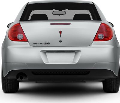 Rear view with tail lights, badge, and trunk details