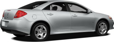 Silver four-door sedan showing side profile with alloy wheels