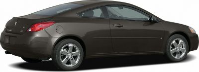Brown two-door coupe with chrome wheels and aerodynamic shape