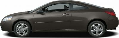 Sleek side profile of a 2-door coupe with smooth lines and chrome wheels.