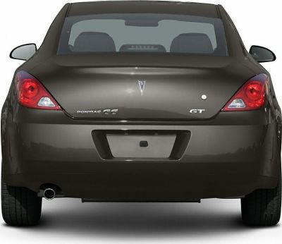Rear view featuring taillights, GT badge, and single exhaust pipe