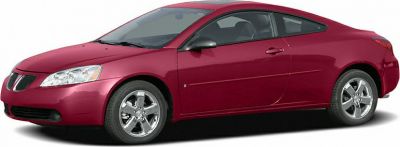 Side profile of a sleek coupe with alloy wheels