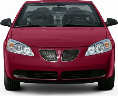Front view of a convertible with distinctive grille and headlights