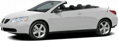 White two-door convertible with retractable roof and alloy wheels