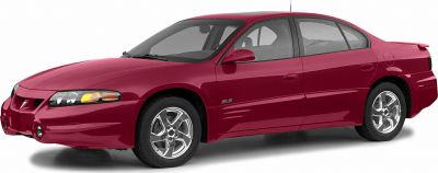 Side view of a sedan with alloy wheels and sporty body kit